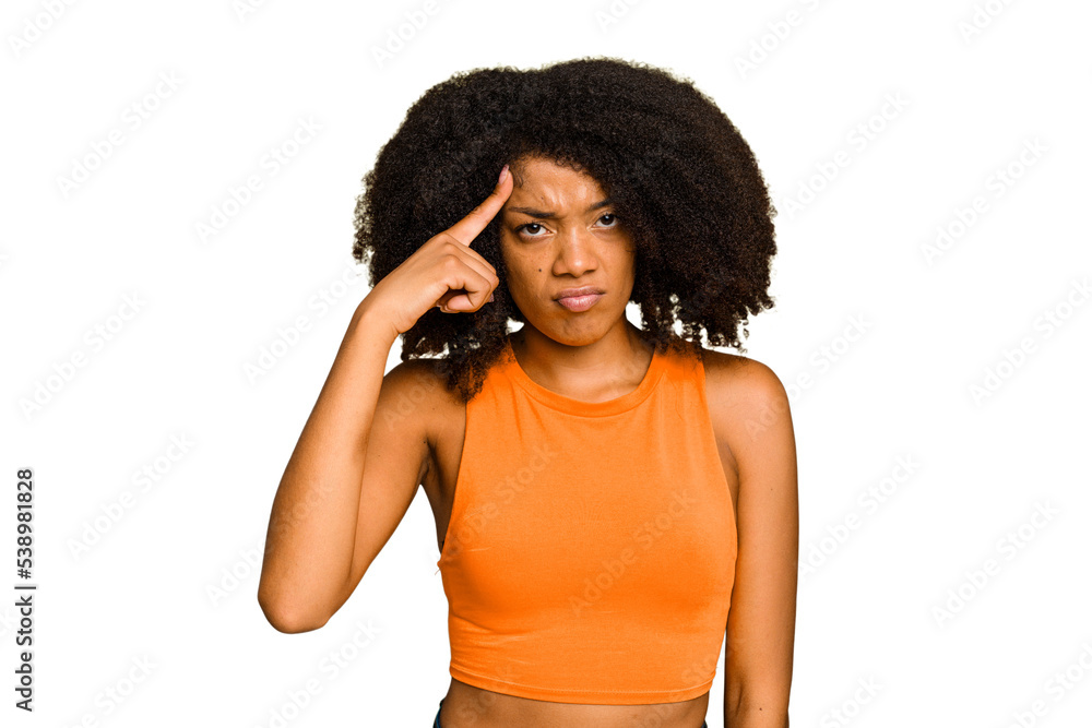 Young African American woman isolated pointing temple with finger, thinking, focused on a task. Young African American woman isolated pointing temple with finger, thinking, focused on a task.