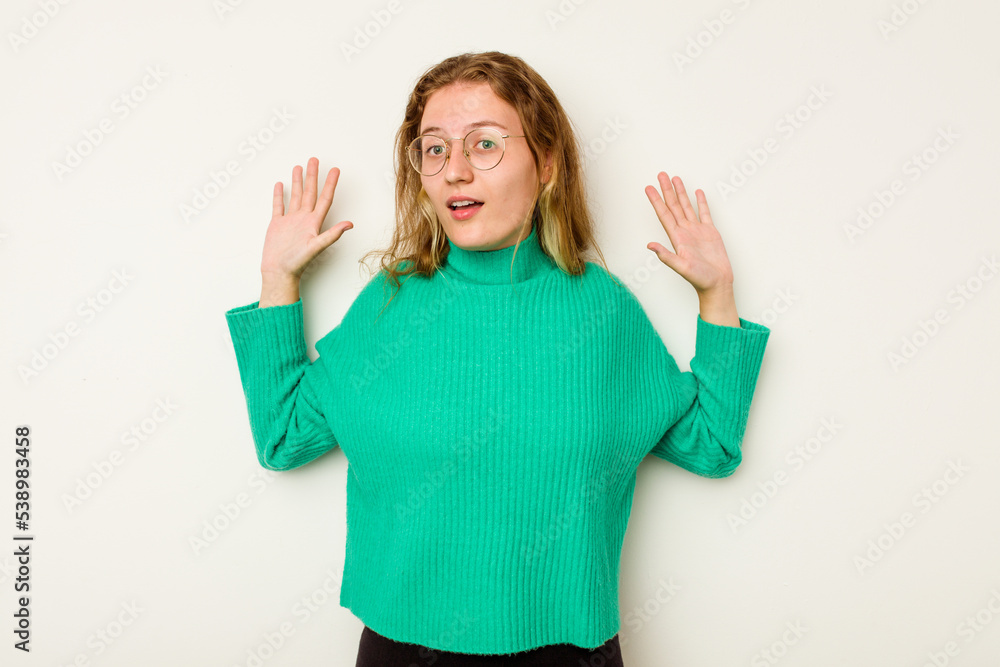 Young caucasian woman isolated on white background being shocked due to an imminent danger Young caucasian woman isolated on white background being shocked due to an imminent danger