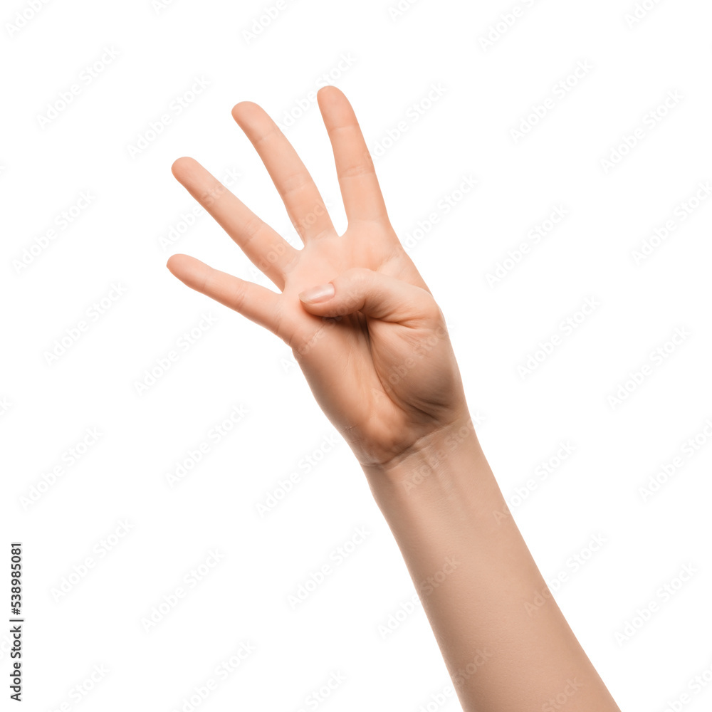 Fototapeta premium A woman's hand shows four fingers on a white background