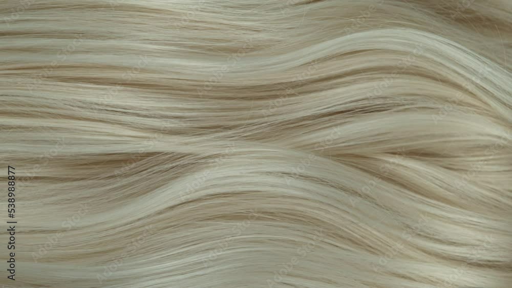 Super slow motion of wavy blonde hair in detail. Filmed on high speed cinema camera, 1000 fps. Super slow motion of wavy blonde hair in detail. Filmed on high speed cinema camera, 1000 fps.