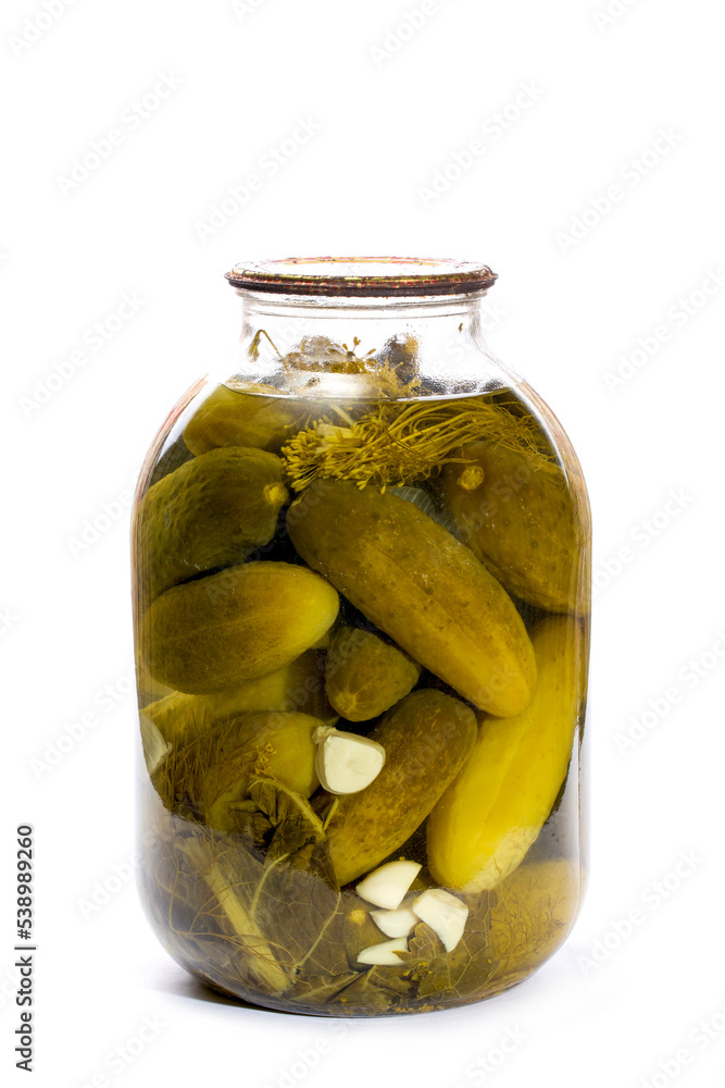 Glass jar with canned cucumbers on a white background Glass jar with canned cucumbers on a white background
