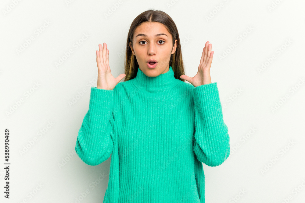 Young Indian woman isolated on white background surprised and shocked. Young Indian woman isolated on white background surprised and shocked.