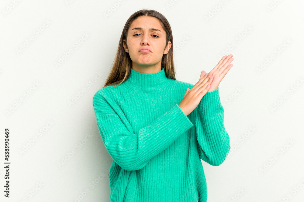 Young Indian woman isolated on white background feeling energetic and comfortable, rubbing hands confident.