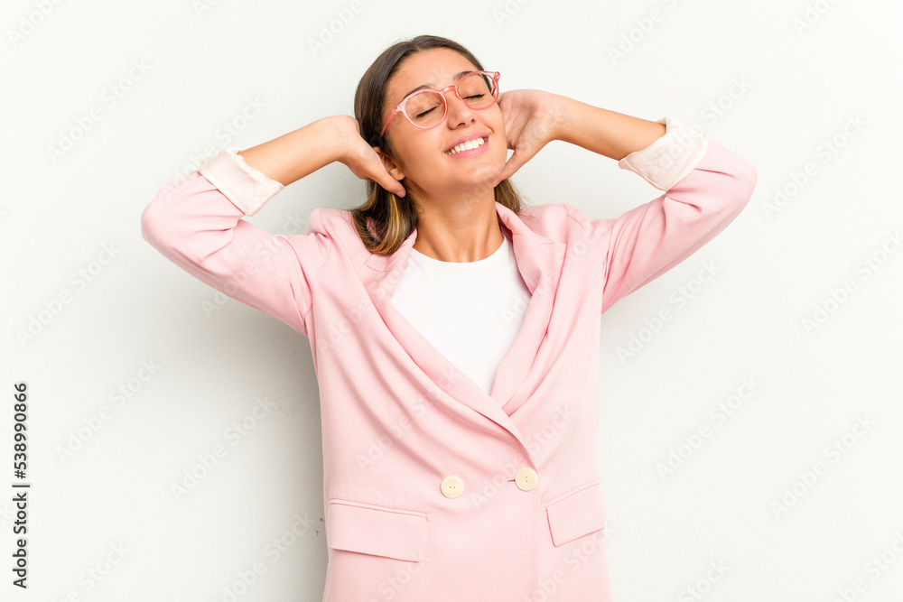 Young Indian woman isolated on white background feeling confident, with hands behind the head. Young Indian woman isolated on white background feeling confident, with hands behind the head.