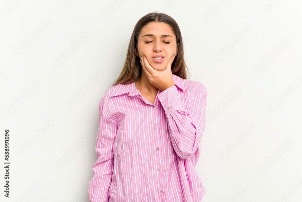 Young Indian woman isolated on white background having a strong teeth pain, molar ache. Young Indian woman isolated on white background having a strong teeth pain, molar ache.