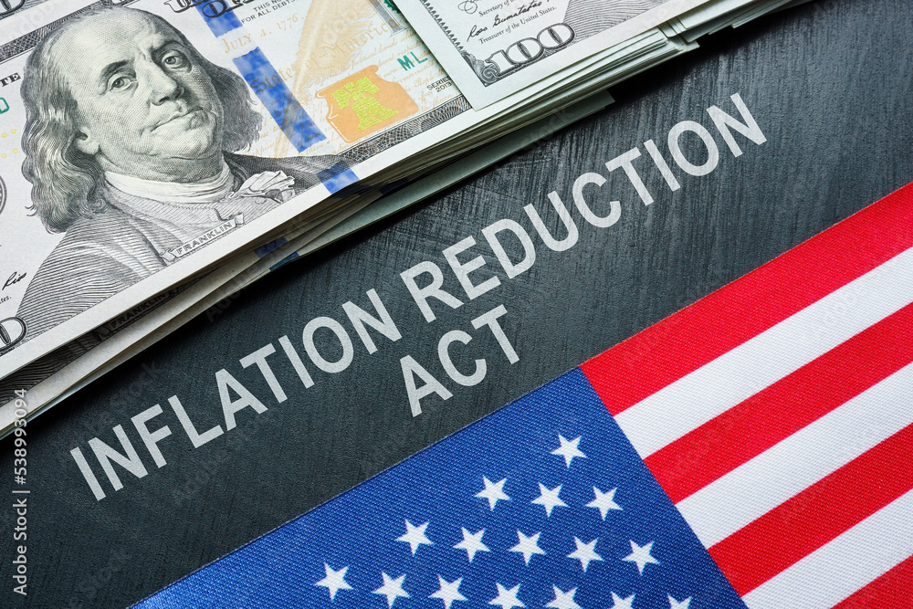 USA flag, dollars and inscription inflation reduction act. USA flag, dollars and inscription inflation reduction act.