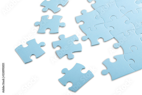 Blue puzzle pieces on grey background