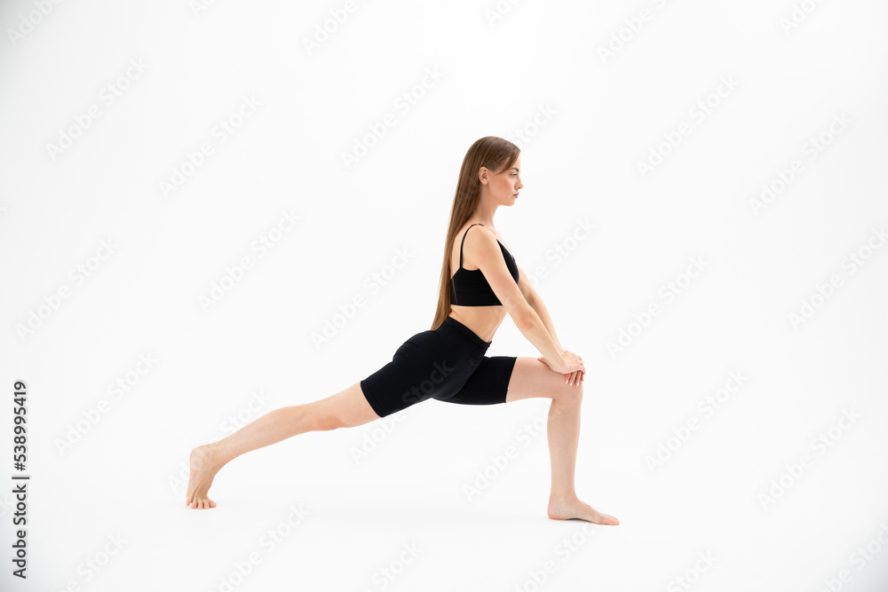 Beautiful girl in sportswear doing yoga Beautiful girl in sportswear doing yoga