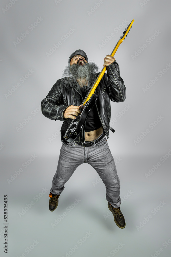 rocker with long beard and leather jacket rocker with long beard and leather jacket