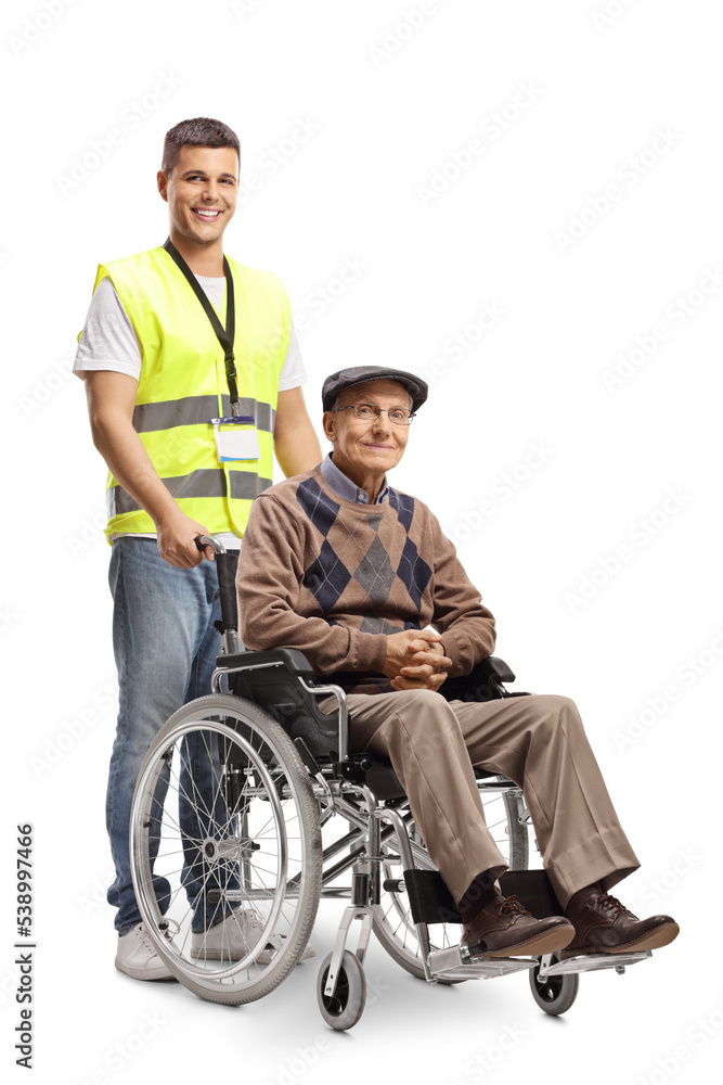 Young volunteer standing behind a wheelchair with an elderly man Young volunteer standing behind a wheelchair with an elderly man