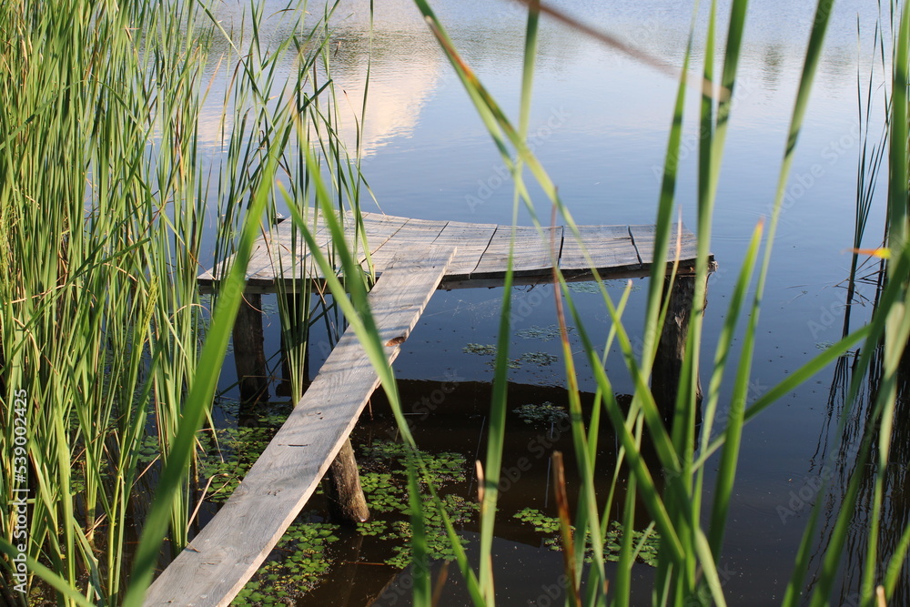 Fototapeta premium Wooden bathing platform on the lake