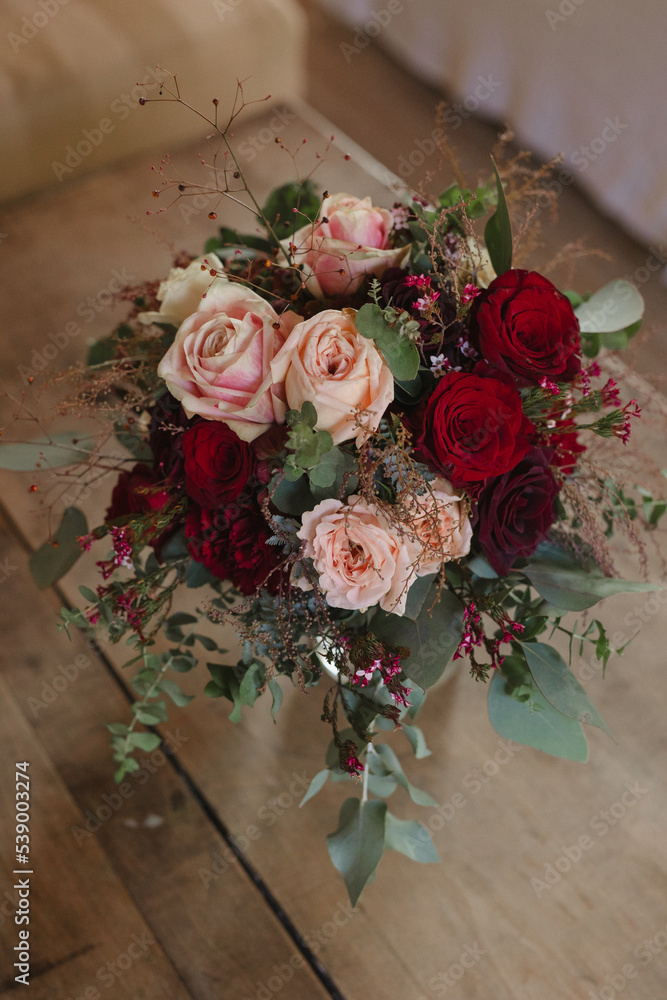 brides bouquet of red and pink roses