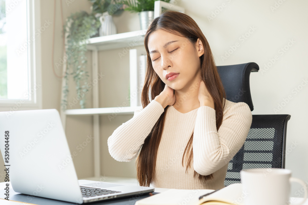 Body muscles stiff problem, ache asian young woman, girl pain neck while sitting work on chair at home, holding massaging rubbing, hurt or sore, Healthcare people, office syndrome . Body muscles stiff problem, ache asian young woman, girl pain neck while sitting work on chair at home, holding massaging rubbing, hurt or sore, Healthcare people, office syndrome .