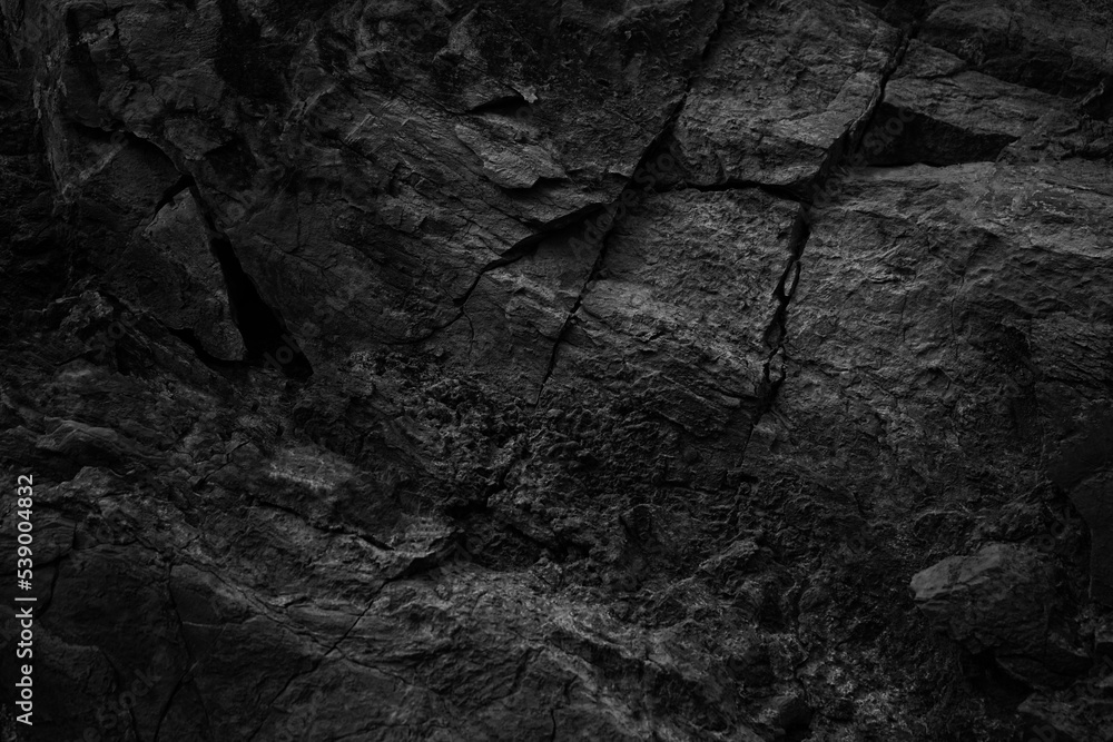 Black white rock texture with cracks. Rough surface mountain surface. Close-up. Dark grey. Stone granite background with space for design. Grunge. Broken. Black white rock texture with cracks. Rough surface mountain surface. Close-up. Dark grey. Stone granite background with space for design. Grunge. Broken.