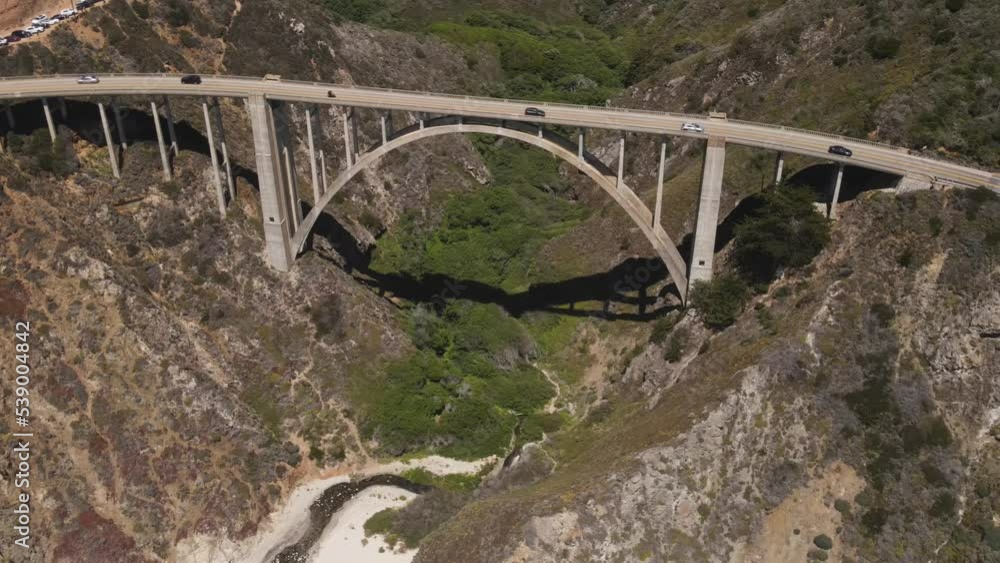 Aerial shot of the Bixby Creek Bridge and rugged coastline along the Pacific Coast Highway in Central California Aerial shot of the Bixby Creek Bridge and rugged coastline along the Pacific Coast Highway in Central California