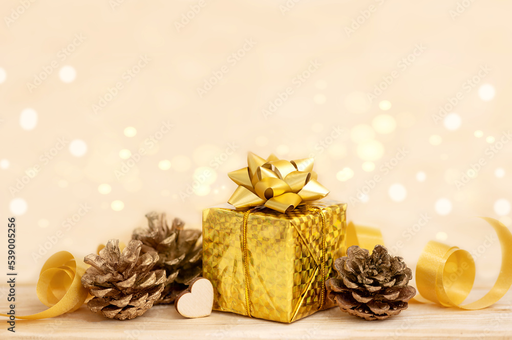 Christmas gift on a light background of blurred bokeh lights