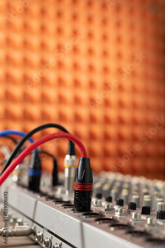 Closeup of sound mixer audio mixing console. Music concept in sound recording studio