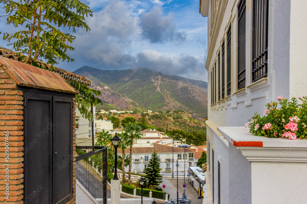 Obraz premium a nice point of view of mountains in Mijas, Malaga, Andalucia, with clouds covering the mountains