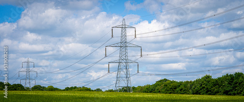 Wallpaper Mural Pylon Power Electricity Electrical Distribution Aerial Cable Running through Countryside Farmer Fields with Blue Sky and White Clouds Torontodigital.ca