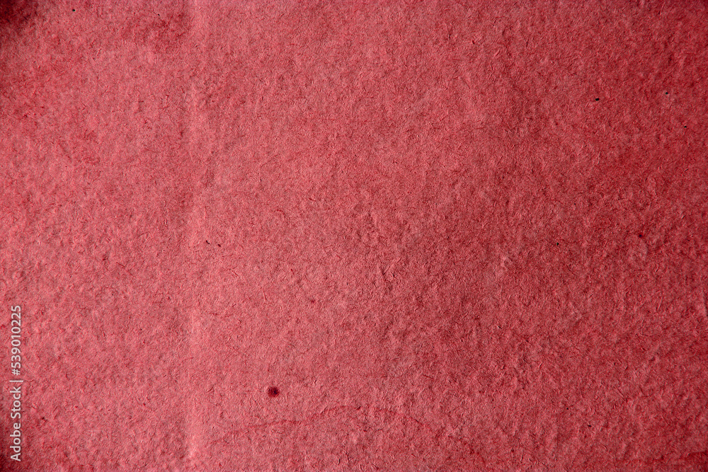 Fototapeta premium Old red vintage paper background or texture