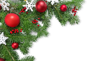 Christmas toys on fir tree branch , isolated on white