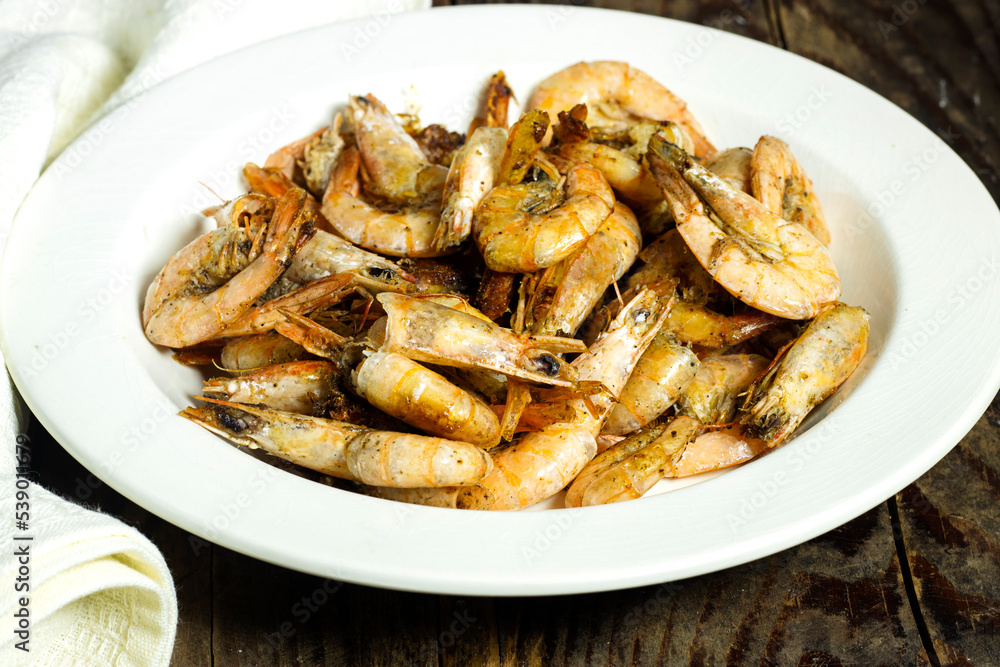 Delicious roasted grilled shrimps on plate