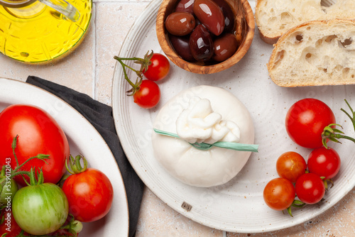 Burrata cheese, various tomatoes and olives