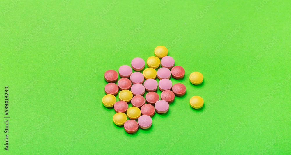 Tablets. Medicine. The science. Pills for diseases on a green background. Tablets. Medicine. The science. Pills for diseases on a green background.