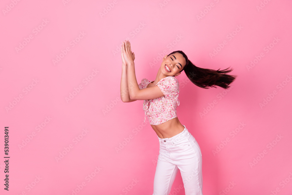 Photo of carefree positive malaysian lady enjoy dancing chilling isolated on pink color background Photo of carefree positive malaysian lady enjoy dancing chilling isolated on pink color background