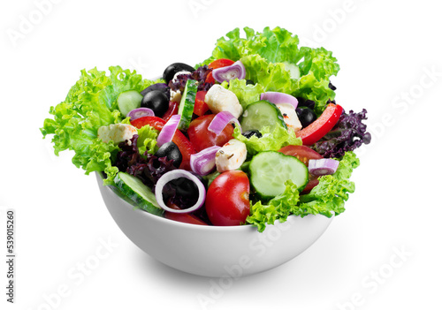 Close-up photo of fresh salad with vegetables in white plate photo