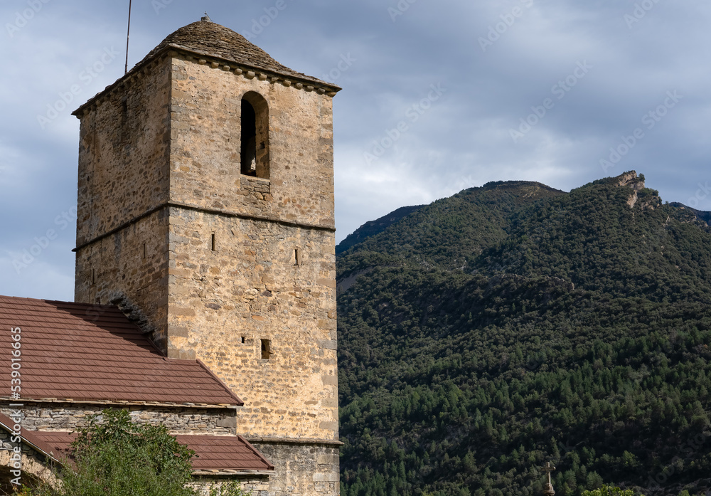 a medieval church bell tower in a mountain village in Spain