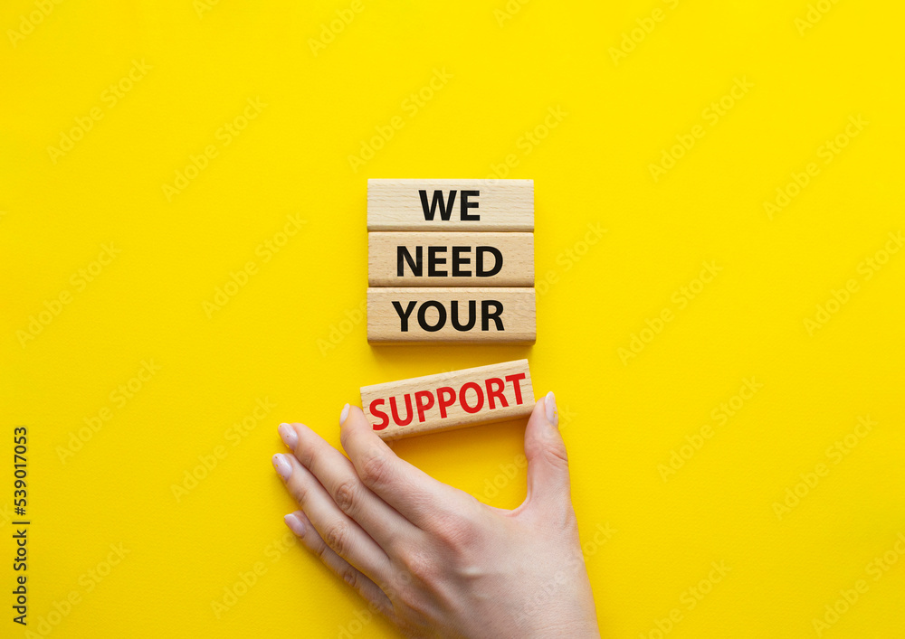 We need your support symbol. Wooden blocks with words We need your ...