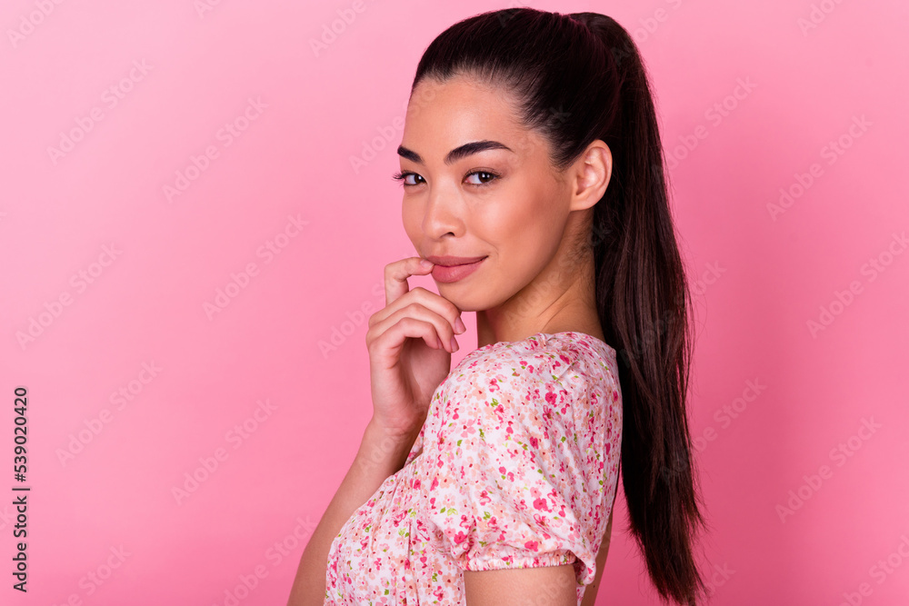 Profile portrait of stunning cute lady hand finger touch lips look camera isolated on pink color background Profile portrait of stunning cute lady hand finger touch lips look camera isolated on pink color background