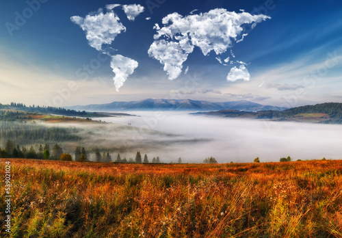 clouds in the form of a map of the world over the mountains. autumn dawn in the Carpathians. Travel and landscape concept 