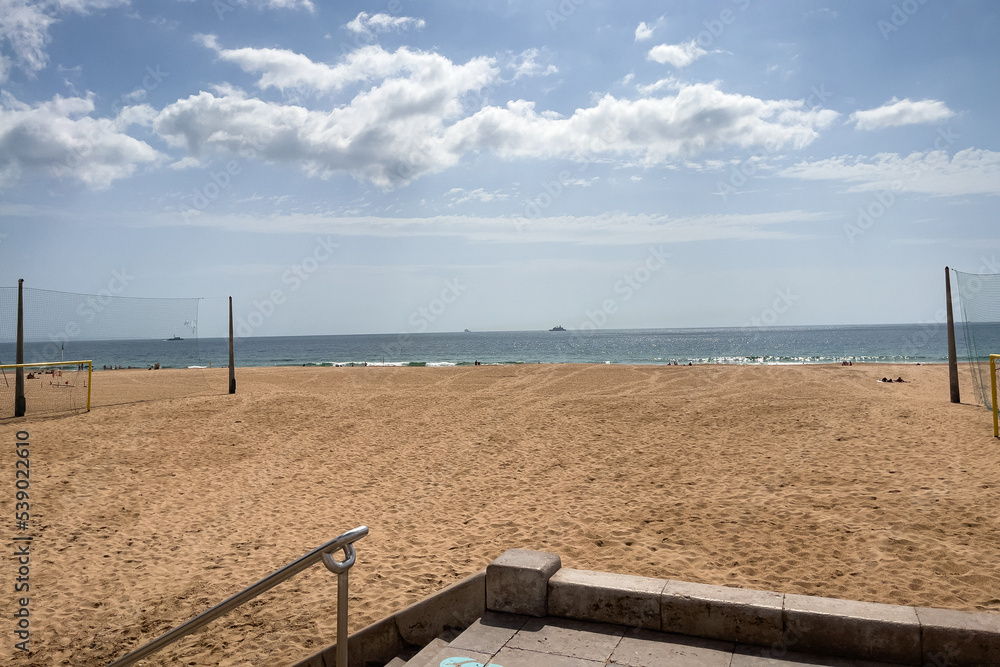 Fototapeta premium People enjoying their time on the beach in Carcavelos, Portugal