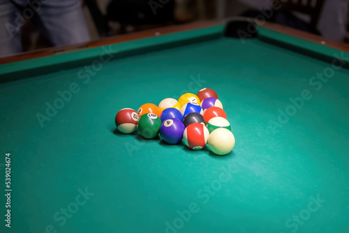 Billiard balls on the table for the game. Pool table set up for start.