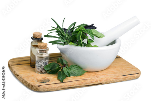 Fresh herbs in the mortar - alternative medicine