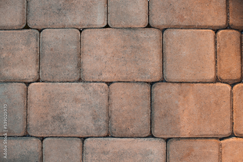 Obraz premium City road tiles with pebble top view close up texture.