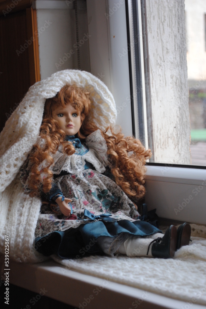 doll in window doll in window