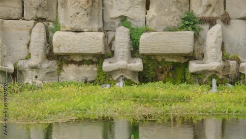 Eflatun Pinar ( Eflatunpinar) Ancient Hittite relief sculpture monument and sacred pool, and its Hittite relief scultures of Hittite gods
 photo