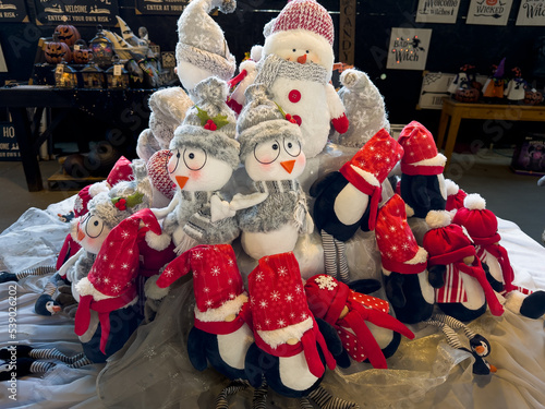 Styalized Christmas penguin dolls with winter hats and clothing, photo