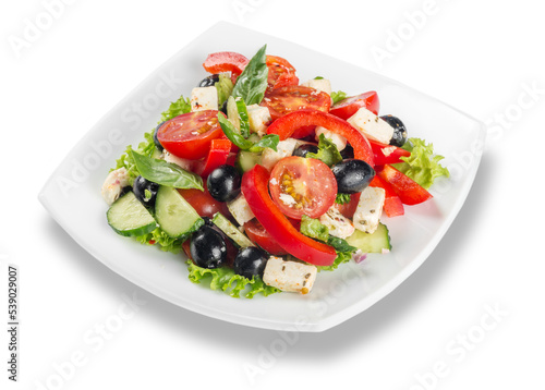 Greek salad with fresh vegetables on white background