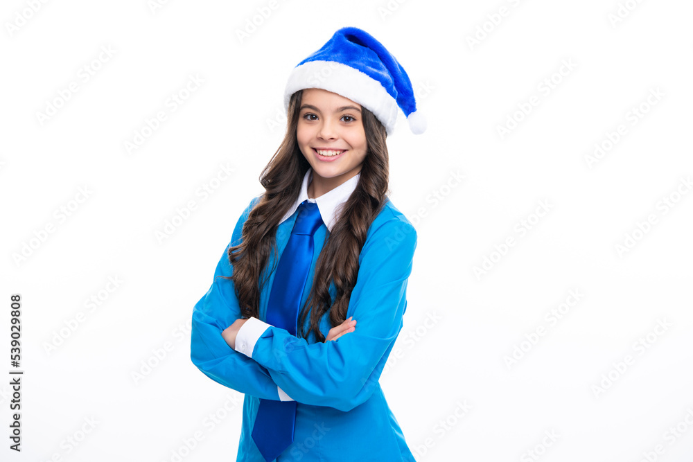 Christmas kids, New Year celebration concept. Portrait a teenage girl child with blue santa hat, shirt and necktie isolated on white background. Christmas kids, New Year celebration concept. Portrait a teenage girl child with blue santa hat, shirt and necktie isolated on white background.