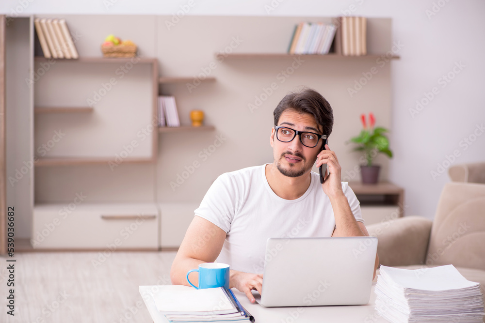 Young male freelancer working from home Young male freelancer working from home