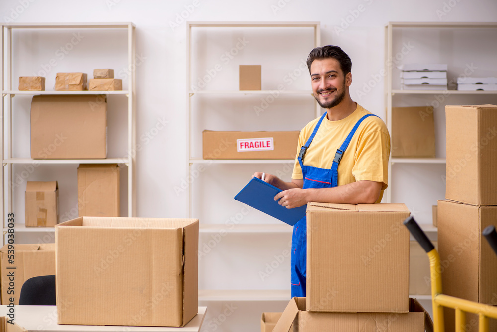 Young male contractor doing home relocation Young male contractor doing home relocation