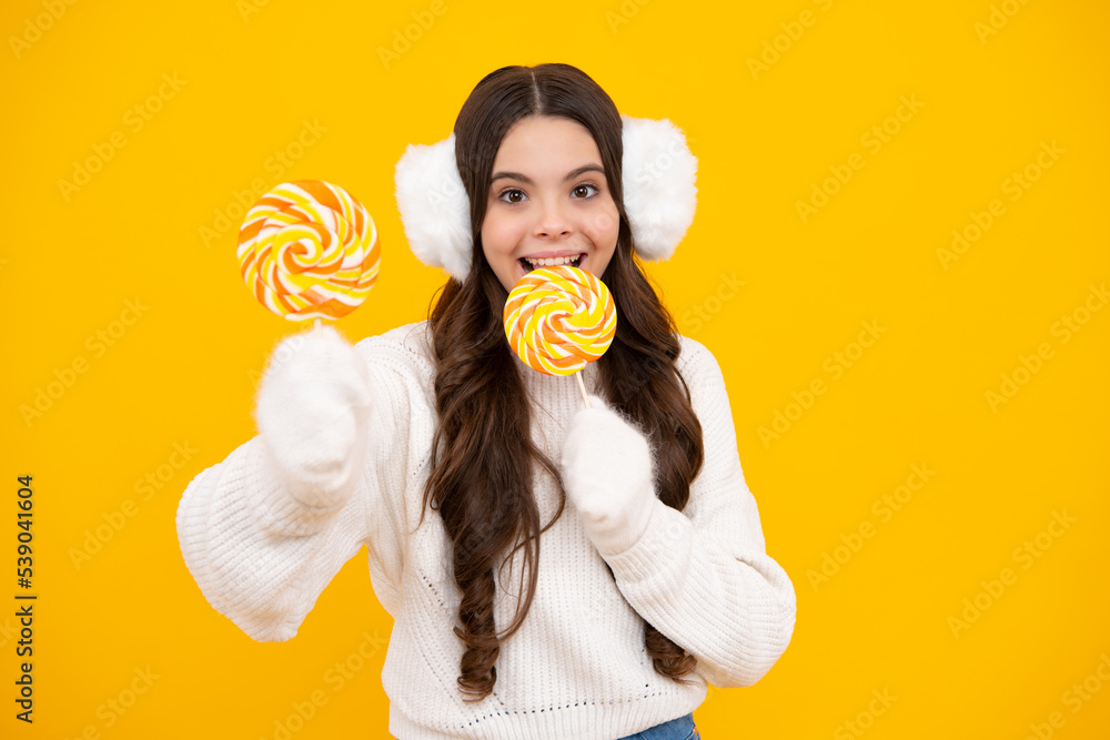 Teenage girl with lollipop, child eating sugar lollipops, kids sweets candy shop. Excited teenager girl. Happy face, positive and smiling emotions of teenager girl.