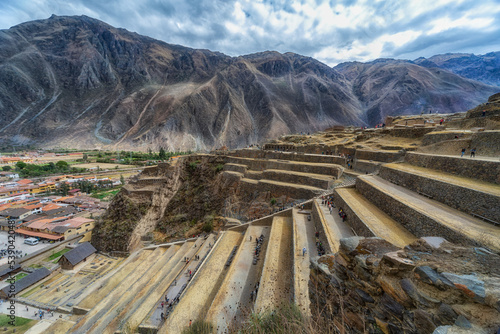 Inca Fortress with Terraces and Temple Hill in Ollantaytambo, Cusco, Peru. Ollantaytambo was the royal estate of Emperor Pachacuti who conquered the region. photo