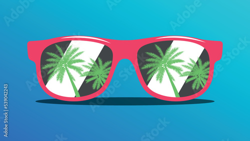 Red sunglasses on the beach with the reflection of palm trees in the lenses