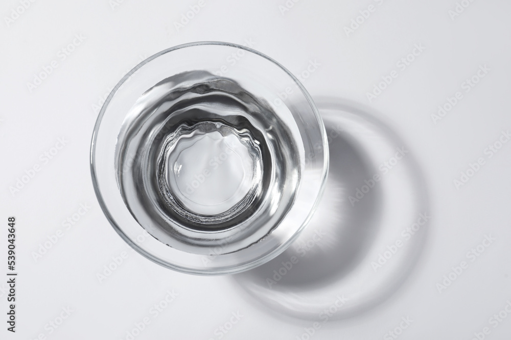 Glass bowl with water on white background, top view Glass bowl with water on white background, top view