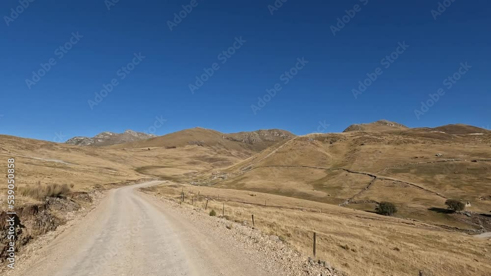 Road trip in the Peruvian Andes. High altitude mountains trip by car crossing the Andean country side. Road trip in the Peruvian Andes. High altitude mountains trip by car crossing the Andean country side.
